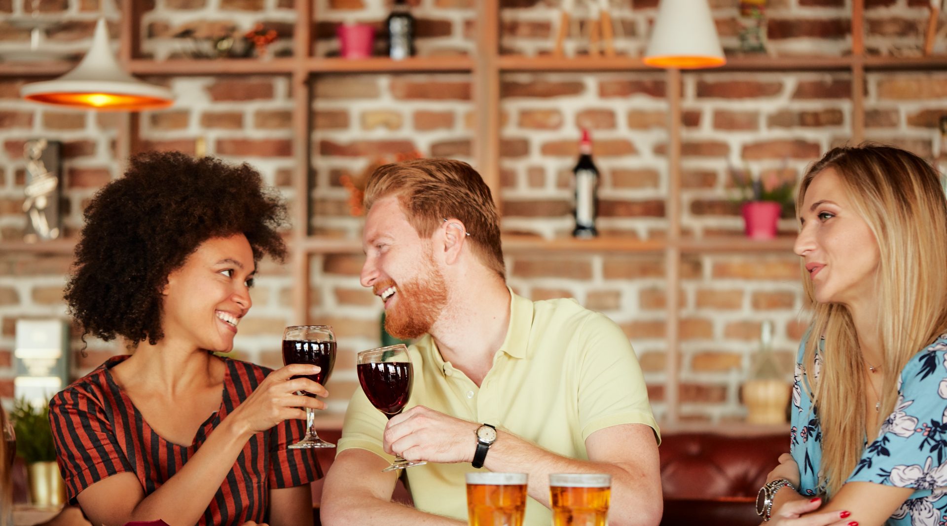 Group of friends having dinner at restaurant.